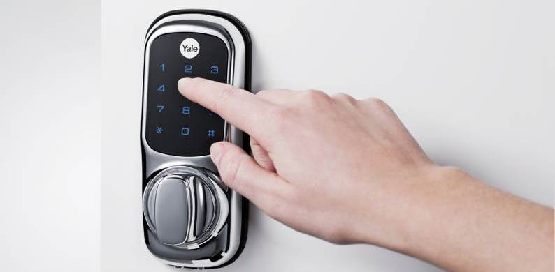 Hand pressing the keypad of a phone